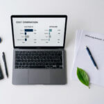 Offshore staffing cost comparison for Australian businesses 2026 - desk with laptop showing cost breakdown chart, Webco Talent"